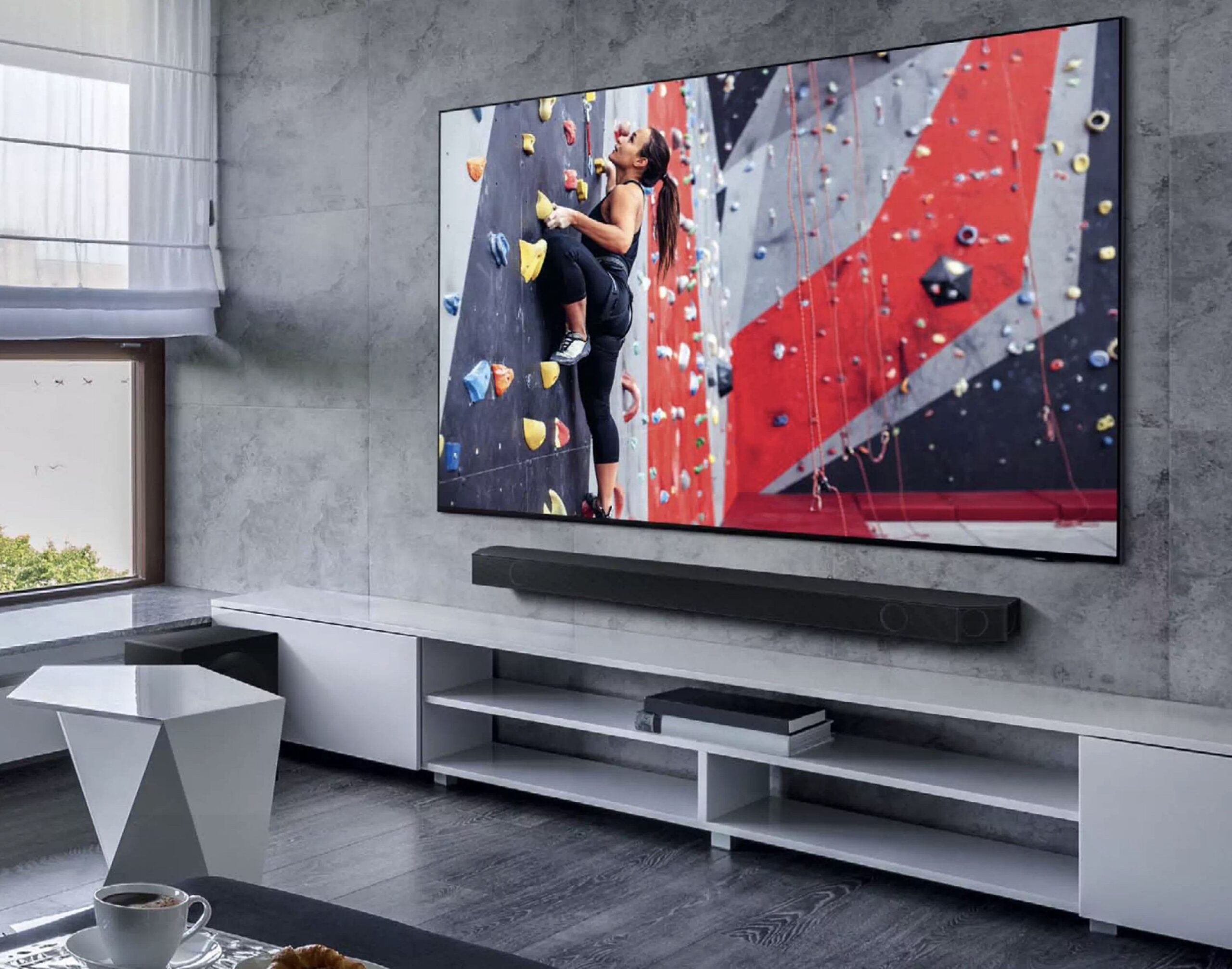 Samsung HW-Q990D Soundbar on table below TV