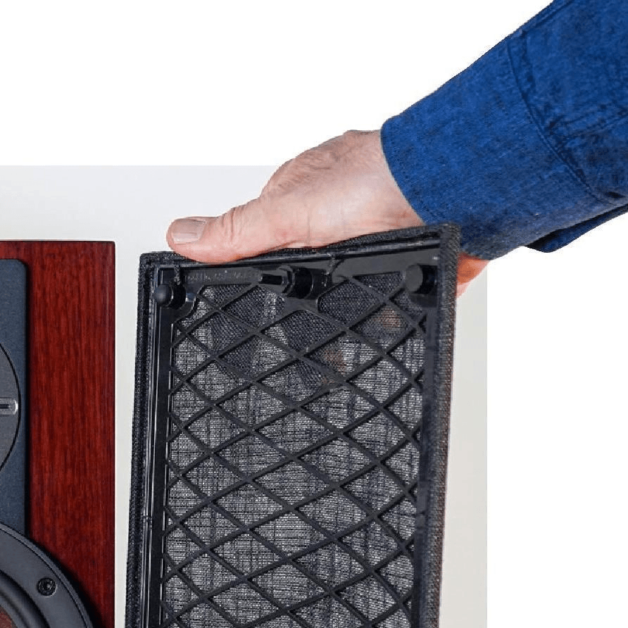 The grille plugs into openings in the driver surrounds.